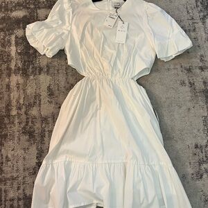White short sleeve dress with side cut outs. Never worn - tags still on